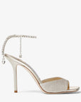 Jimmy Choo Women's Saeda Sandal 100 Platinum Ice Dusty Glitter Sandals with Crystal Embellishment