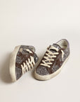 Golden Goose Women’s Super-Star in glitter with a brown star and lilac heel tab