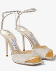 Jimmy Choo Women's Saeda Sandal 100 Platinum Ice Dusty Glitter Sandals with Crystal Embellishment